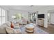 Stylish living room with shuttered windows, and a sliding glass door to the porch at 9000 Palmetto Dr # C104, Isle of Palms, SC 29451