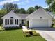 Charming single-story home with white siding, black shutters, and a well-manicured lawn at 1048 Wayfarer Ln, Charleston, SC 29412