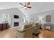 Bright living room with vaulted ceilings, a fireplace, and large windows at 1048 Wayfarer Ln, Charleston, SC 29412