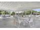 Spacious covered patio area with multiple tables and chairs, perfect for relaxing and enjoying the outdoors at 1048 Wayfarer Ln, Charleston, SC 29412