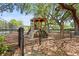 Charming community playground, featuring a play structure with slide, climbing area, and leafy surroundings at 1048 Wayfarer Ln, Charleston, SC 29412