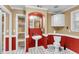 Bathroom featuring red accent walls, a pedestal sink, and black-and-white patterned tile flooring at 1060 Oakcrest Dr, Charleston, SC 29412