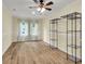 Light and airy bedroom with wood-look floors, ample natural light, and shelving units at 1060 Oakcrest Dr, Charleston, SC 29412