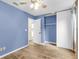 Bedroom features wood-look floors, a ceiling fan, and closet with sliding doors at 1060 Oakcrest Dr, Charleston, SC 29412