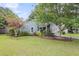 Charming single-story home with lovely front yard landscaping at 1060 Oakcrest Dr, Charleston, SC 29412