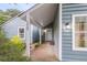 View of the front entryway with covered porch and view of the home's number at 1060 Oakcrest Dr, Charleston, SC 29412