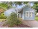 Inviting single-Gathering home features light-blue siding, well-maintained landscaping, and a welcoming front entrance at 1060 Oakcrest Dr, Charleston, SC 29412