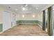 Bright living room featuring wood-look tile floors, recessed lighting, and access to the outside patio at 1060 Oakcrest Dr, Charleston, SC 29412
