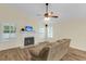 Cozy living room with vaulted ceilings, a ceiling fan, fireplace, and wood-look floors at 1060 Oakcrest Dr, Charleston, SC 29412