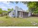 Charming home featuring a screened porch, shed, chimney, and a spacious backyard at 1060 Oakcrest Dr, Charleston, SC 29412