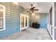 Screened-in porch with blue siding, wood ceiling, ceiling fan, and a covered grill in the corner at 1060 Oakcrest Dr, Charleston, SC 29412