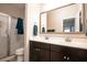 Well-lit bathroom with double sinks, modern vanity, and a glass-enclosed shower at 1061 Ashley Gardens Blvd, Charleston, SC 29414