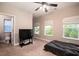 Bedroom featuring two bright windows, and a door to an ensuite bathroom at 1061 Ashley Gardens Blvd, Charleston, SC 29414