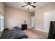Cozy bedroom with a ceiling fan, neutral walls, carpet, and a window for natural light at 1061 Ashley Gardens Blvd, Charleston, SC 29414
