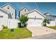 Detached white garage surrounded by healthy green grass and leafy trees at 1061 Ashley Gardens Blvd, Charleston, SC 29414