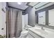Cozy bathroom with shower and tub, gray walls, and white sink at 1115 Shadow Lake Cir, Mount Pleasant, SC 29464