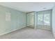 Bright bedroom with mirrored closet doors and large windows allowing ample natural light at 1115 Shadow Lake Cir, Mount Pleasant, SC 29464
