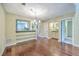 Cozy dining area with hardwood floors, elegant chandelier, and views into other rooms at 1115 Shadow Lake Cir, Mount Pleasant, SC 29464