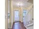 Inviting foyer featuring hardwood floors, a chandelier, and staircase leading to upstairs at 1115 Shadow Lake Cir, Mount Pleasant, SC 29464