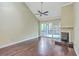 Spacious living room boasting hardwood floors, fireplace, and sliding glass doors to lanai at 1115 Shadow Lake Cir, Mount Pleasant, SC 29464