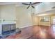 Open living room with a fireplace, hardwood floors, and view into the kitchen at 1115 Shadow Lake Cir, Mount Pleasant, SC 29464
