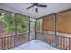 Enclosed porch with ceiling fan and views of the surrounding foliage at 1115 Shadow Lake Cir, Mount Pleasant, SC 29464