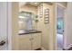 Convenient wet bar features a sink, shelving, and a mirror for entertaining at 1115 Shadow Lake Cir, Mount Pleasant, SC 29464