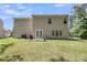 Expansive backyard featuring a patio and lush lawn, perfect for outdoor enjoyment and entertaining at 113 Southernwood Dr, Ladson, SC 29456