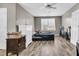 Large bedroom has wood-look floors, a window for natural light, and some furnishings at 113 Southernwood Dr, Ladson, SC 29456