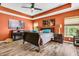 Primary bedroom showcasing a queen-sized bed, complementary lamps, wooden furniture and bright natural light at 113 Southernwood Dr, Ladson, SC 29456