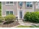 Charming home entrance featuring a well-lit doorway and manicured landscaping, offering a welcoming ambiance at 113 Southernwood Dr, Ladson, SC 29456