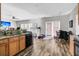 Well-lit kitchen with wood cabinets, modern stainless steel appliances, and granite countertops at 113 Southernwood Dr, Ladson, SC 29456