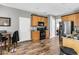 Well-lit kitchen with wood cabinets, modern stainless steel appliances, and granite countertops at 113 Southernwood Dr, Ladson, SC 29456