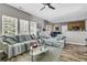 Comfortable living room with a ceiling fan and natural light from the many bright windows at 113 Southernwood Dr, Ladson, SC 29456