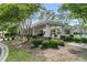 Pool house with white pillars, covered area, and adjacent landscaping for a stylish outdoor experience at 113 Southernwood Dr, Ladson, SC 29456