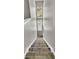 Stairwell with runner has a long window letting in natural light for a bright and elegant look at 113 Southernwood Dr, Ladson, SC 29456