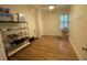 Bright bedroom with hardwood floors, ceiling fan, and neutral walls at 116 W 5Th South St # D, Summerville, SC 29483