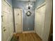 Bright entryway with wooden floors, a decorative wreath, and ample closet space for storage and organization at 116 W 5Th South St # D, Summerville, SC 29483