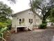 Charming home exterior with a small porch, flower boxes and mature trees at 116 W 5Th South St # D, Summerville, SC 29483