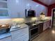 Modern kitchen with stainless steel appliances, granite countertops, and ample storage space at 116 W 5Th South St # D, Summerville, SC 29483