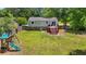 Aerial view of backyard with playset, patio, and fenced-in yard at 117 Canaberry Cir, Summerville, SC 29483