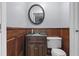 Bathroom featuring a dark wood vanity, decorative mirror, and toilet at 117 Canaberry Cir, Summerville, SC 29483