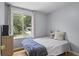 Bright bedroom with hardwood floors, a large window and view of the outdoors at 117 Canaberry Cir, Summerville, SC 29483