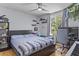 Cozy bedroom with a dark bed frame, hardwood floors, and a window view at 117 Canaberry Cir, Summerville, SC 29483