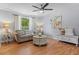 Inviting living room featuring hardwood floors, a ceiling fan, neutral paint and lots of natural light at 117 Canaberry Cir, Summerville, SC 29483