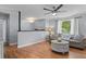 Inviting living room with hardwood floors, a ceiling fan, neutral paint and natural light from the window at 117 Canaberry Cir, Summerville, SC 29483