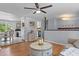 Open-concept living room featuring hardwood floors, a ceiling fan, neutral paint and lots of natural light at 117 Canaberry Cir, Summerville, SC 29483
