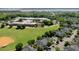Community aerial view showcasing green spaces, baseball field, clubhouse, and well-maintained neighborhood streets at 1225 Blakeway St # 407, Charleston, SC 29492