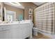 Bathroom featuring white cabinets, neutral walls, a shower and tub combination, and vanity with a large mirror at 1225 Blakeway St # 407, Charleston, SC 29492