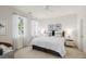 Bright bedroom with a large bed, ceiling fan, and two windows providing natural light at 1225 Blakeway St # 407, Charleston, SC 29492